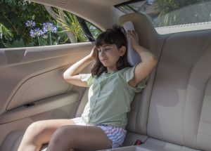 Little girl with travel pillow